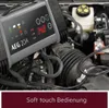 A car battery charger is connected to a car engine. Produktbild-Vorschau