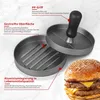 A burger press and a burger are shown on a marble background. Produktbild-Vorschau