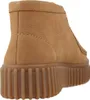 A close-up side view of a brown clog. Voir les images du produit