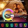 Three children are smiling and looking at the camera behind a colorful LED lamp with a wireless charger and clock. Produktbild-Vorschau