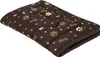 A brown dog bed with a pattern of gold paw prints and bones, lying on a white background. Náhled obrázku produktu