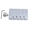 A silver-colored E-bass bridge with screws and an Allen wrench on a white background. Podgląd zdjęcia produktu
