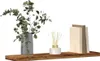 A shelf with decorative items. Produktbild-Vorschau