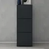 A dark gray shoe cabinet with three drawers against a textured gray wall. Produktbild-Vorschau