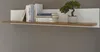 A floating shelf with books and a small potted plant. Produktbild-Vorschau