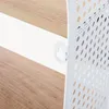 A close-up view of a white metal bracket attached to a wooden shelf. Produktbild-Vorschau