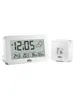 A white digital alarm clock with a weather station display and a separate wireless sensor are shown on a white background. Produktbild-Vorschau