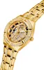 A close-up shot of a gold Guess watch with diamond accents. Náhľad obrázku produktu