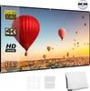 A projection screen displaying a vibrant image of hot air balloons over a city at sunset. The screen is framed by a black border and has grommets for hanging. Below the screen are several white adhesive hooks and a folded white projection screen. Náhled obrázku produktu