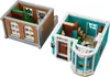 Two modular sections of a LEGO building, resembling a bookstore and an adjacent building, are displayed against a white background. Produktbild-Vorschau