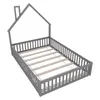 A grey wooden bed frame with a house-shaped headboard and a slatted base, shown from a slightly elevated diagonal angle against a white background. Voir les images du produit