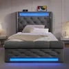 A modern upholstered bed with integrated LED lighting and charging ports. Náhled obrázku produktu