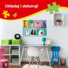 A room with a desk, chair, and a puzzle on the wall. Náhľad obrázku produktu