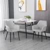 A dining set with two chairs and a table in a room. Voir les images du produit