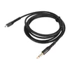 A black audio cable coiled on a white background. Podgląd zdjęcia produktu