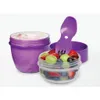 Two purple containers, one with yogurt and one with fruit salad, with a purple spork. Podgląd zdjęcia produktu