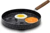 A frying pan with a fried egg and a pancake on it. Produktbild-Vorschau