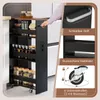 A person's hand is pulling a narrow kitchen cart with shelves filled with jars and bottles out from a gap between cabinets. The cart has wheels and a handle. Insets show close-ups of the handle, a shelf railing, and a wheel with locks. Podgląd zdjęcia produktu