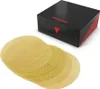 A black box with red accents and a red triangle logo sits behind several round, yellow sanding discs. Produktbild-Vorschau