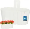 A white hanging planter with flowers and a 'Made in EU' tag. Podgląd zdjęcia produktu