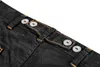 A close-up view of the waistband of black work pants, showing adjustable straps with buttons. Náhled obrázku produktu
