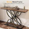 A long, narrow console table with a wooden top and a decorative metal base, placed against a wall in a room. Náhled obrázku produktu