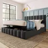 A bedroom scene featuring a bed with storage.