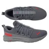A top-down and side view of a pair of gray Puma sneakers with red accents. Produktbild-Vorschau