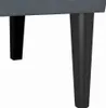 A close-up view of the legs of a sofa or bench. Náhled obrázku produktu