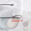 A close-up of a gray drawstring loop on a white fabric, with a red bracket indicating a measurement. Produktbild-Vorschau