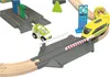 A toy train set with a gas station and a crossing. Produktbild-Vorschau