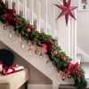 Christmas garland decorated with ornaments and bows along a staircase. Podgląd zdjęcia produktu