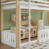 A children's loft bed with a play kitchen and washing machine underneath, set against a green wall. Produktbild-Vorschau