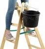A person standing on a wooden ladder with a bucket attached. Voir les images du produit