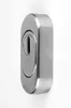 A close-up studio shot of a silver oval door escutcheon with a keyhole. Produktbild-Vorschau