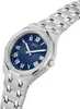 A close-up studio shot of a men's wristwatch with a blue dial and silver metal band. Náhled obrázku produktu