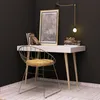 A minimalist desk setup in a corner with a chair, desk, and framed artwork. Podgląd zdjęcia produktu