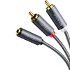 A close-up shot of a Ugreen audio cable with RCA connectors. Podgląd zdjęcia produktu