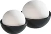 Two white spherical humidifiers sit in black bowls. Produktbild-Vorschau