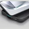 Close-up of a phone case with a reflective, angular interior. Produktbild-Vorschau