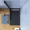 A top-down view of a modern shower enclosure with a black base and glass door, set against a tiled wall and wooden floor. Produktbild-Vorschau
