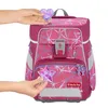 Hands are shown attaching decorative elements to a pink backpack with a geometric pattern. Náhled obrázku produktu