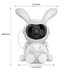 A white robot-shaped night light projector with rabbit ears, showing its dimensions. Náhled obrázku produktu