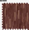 A set of interlocking floor mats with a wood grain pattern. Náhľad obrázku produktu