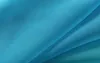 A close-up view of draped turquoise fabric. Produktbild-Vorschau