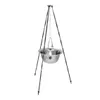 A tripod stand with a metal pot hanging from it. Produktbild-Vorschau