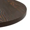 Close-up view of the edge of a round table with a dark wood grain pattern. Náhľad obrázku produktu