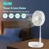 A white portable fan is shown on a wooden table in front of a blurred bedroom setting. The image highlights the fan's timer and low noise features with text overlays. Náhľad obrázku produktu
