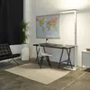 A modern office or workspace with a desk, chair, lamp, and world map. Produktbild-Vorschau
