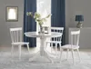 A white round dining table with three white chairs in a dining room setting. Náhľad obrázku produktu